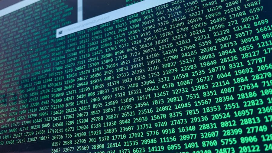 Vibrant green numbers on a computer screen, showcasing binary code and data streams.